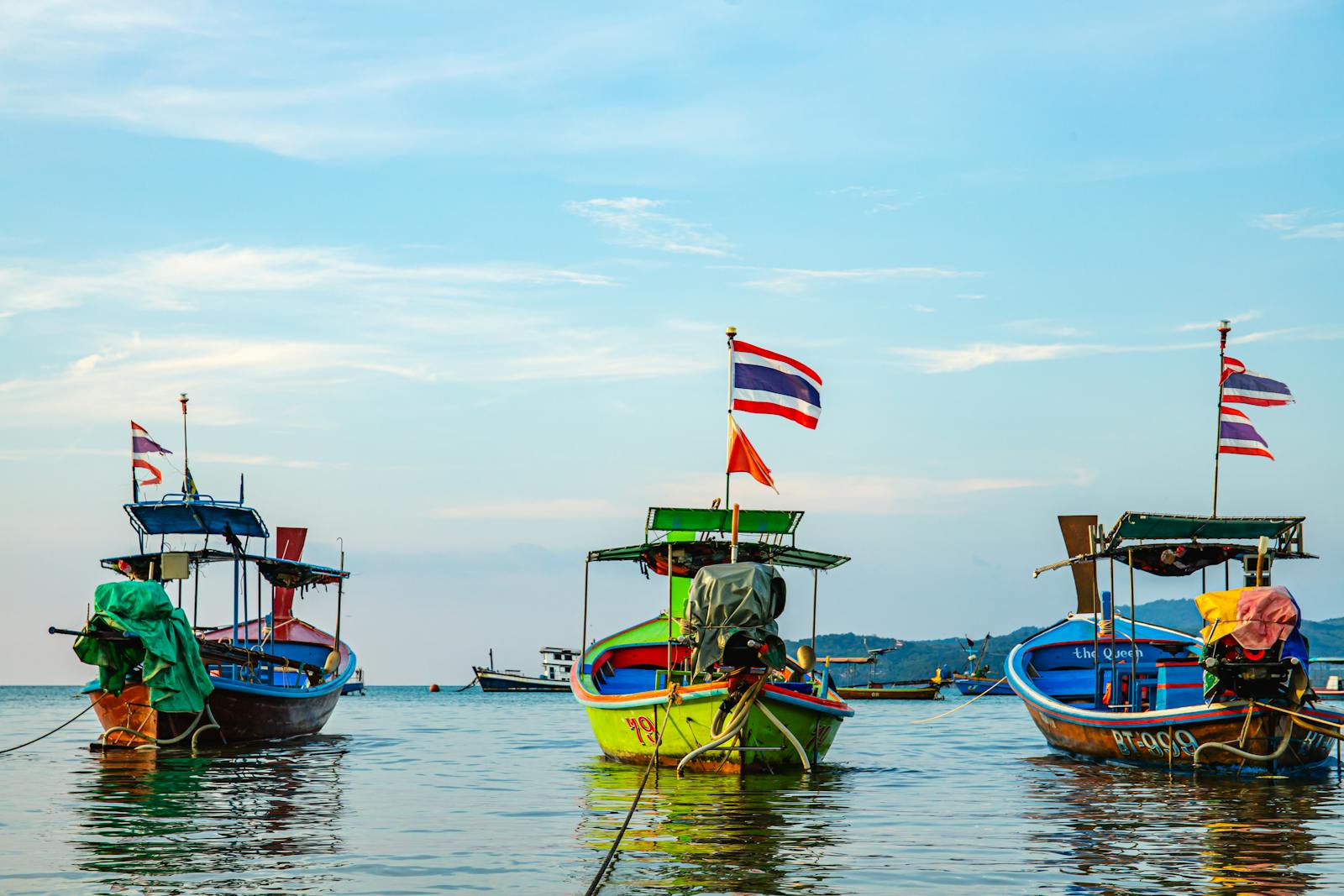 Phuket coastline with traditional Thai longtail boats